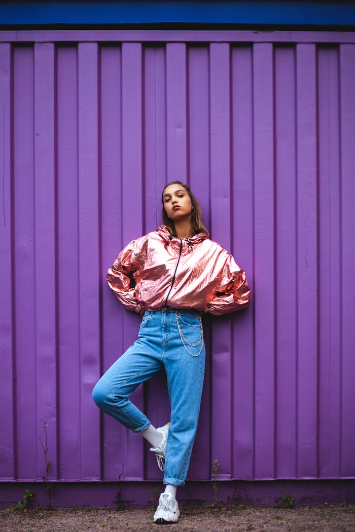 Woman In Pink Zip-up Jacket And Blue Denim Jeans